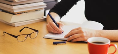 <a href="https://www.freepik.com/free-photo/closeup-shot-woman-working-studying-from-home-with-red-c