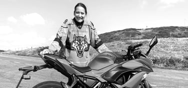 Becky stood next to her Ninja 650 at the side of the road