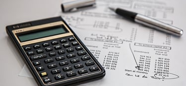 Calculator and financial papers representing financial translations