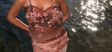 a woman in a dress with a large afro - american afro - american hair