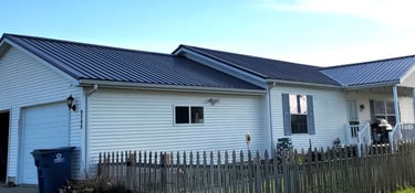 Steel roof attached to local home by Gotcha Covered Builders.