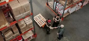 Warehouse workers managing inventory and logistics for supply chain operations