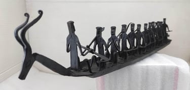 "Handmade Bastar Tribal Iron Boat-with Deer Head and 10 Seated Figures–Left Side View-Export-standard"