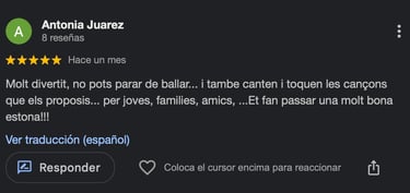 A 5-star Google review by Antonia Juarez praising a lively music and dance event for families.