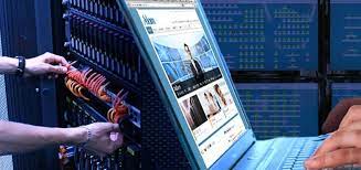 a man is holding a laptop computer and a laptop