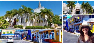 Autora explorando as ruas coloridas de George Town, Grand Cayman, com destaque para igrejas históricas ao fundo.