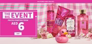 An advertisement for Bath & Body Works' The Big Event, showing various pink-themed body care product