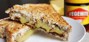 a sandwich with cheese and vegemite on it. Australian vegemite