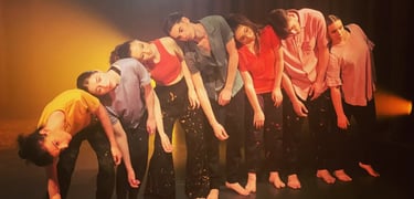 a group of people standing in a line of dancers