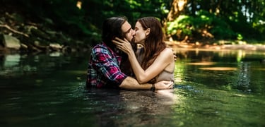 Lancaster PA couples photographer. Photo of couple kissing in creek