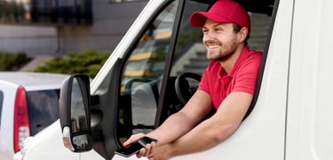 a delivery man in a red shirt and red cap
