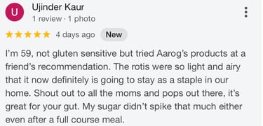 Positive 5-star Google review for Aarog gluten-free rotis praising gut health and blood sugar stability.
