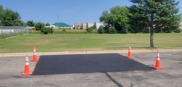 large-asphalt-repair-in-commercial-parking-lot.jpg