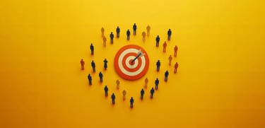 Miniature people surrounding a red bulls-eye