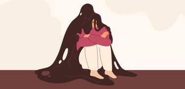 pessoa encolhida no chao com crise de ansiedade