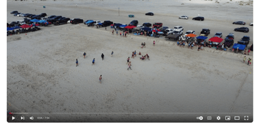 a group of people standing on a beach drone shot rugby rugby maul scrum lineout corpus christi
