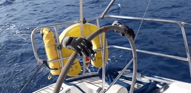 a boat steered by gloves. Copyright Vincent Volpe