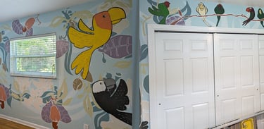 Bedroom mural of colorful parrots and floral pattern of almonds and pistachios in bright but soothing colors of blues.