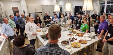 Chef Andrew gives a presentation in a modern home on kitchen appliances.