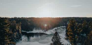 a river with a sun shining through the trees, Canada Nature