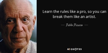 Photograph of an elderly, balding Pablo Picasso alongside one of his quotes about art