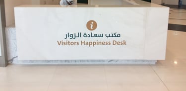 a man sitting at a desk in a lobby