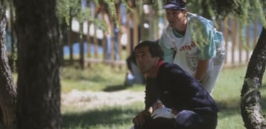 Seve and Billy crouching down to view the impossible gap