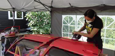 Joy van Haelen sanding her Volvo 850R door