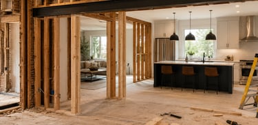 Open concept kitchen renovation featuring exposed wood framing and a steel support beam.