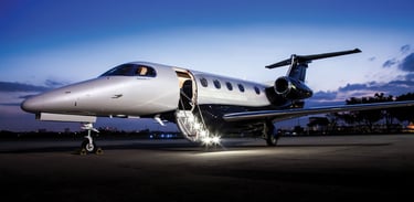 Luxury private jet with open door, illuminated at dusk for an exclusive travel experience. Ideal for VIP aviation, corporate 