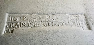 a 400 year old sign on the side of a wall