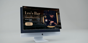 a computer monitor screen displaying a picture of a man pouring a drink