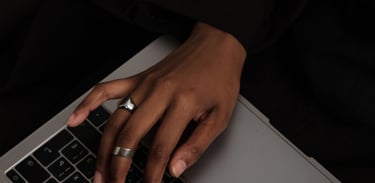 a woman's hands on a laptop computer