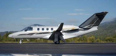 Cessna Citation M2 sitting on an airport ramp.