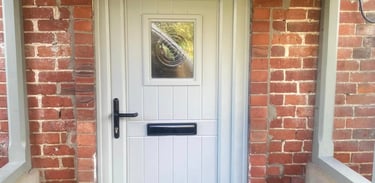 a white door with a black door and a blue bag