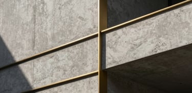 Minimalist concrete structure with brushed brass geometric lines, dramatic chiaroscuro lighting, deep shadows, high-end architectural texture