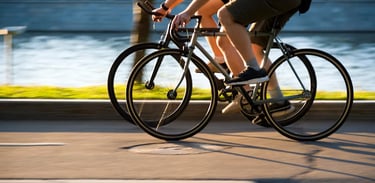 two people cycling on bikes side-by-side