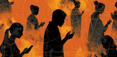 a group of people standing around a cell phone