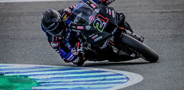 a person riding a motorcycle on a track