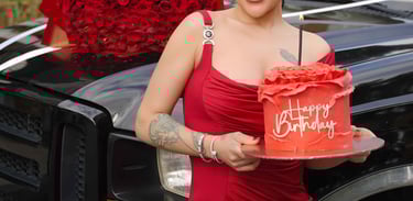 Woman holding birthday cake and red roses by limo, shot by Fred Art Studio