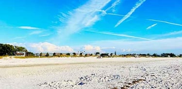 Scenic beaches with soft white sand and clear blue water on Anna Maria Island, Florida.
