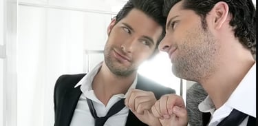 conceited guy staring at himself in mirror