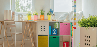 childs room with a desk with a chair and easy organiser