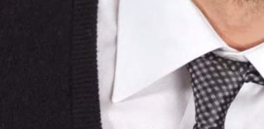 a close of a man wearing a shirt with a tie by the brand Monti