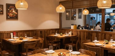 Elegant restaurant dining room with ambient lighting and neatly set tables.