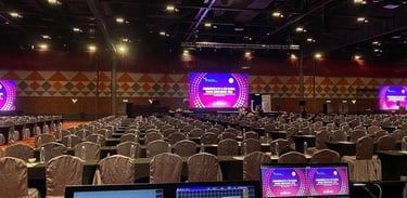 Conference & Corporate Meetings Backdrop setup, AV support, registration counters and signage.