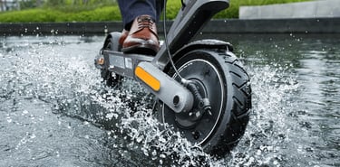 a person riding a scooter in the water