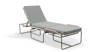 a hospital bed with a chair and a chair