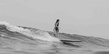 Woman surfing at Santa Teresa, Costa Rica