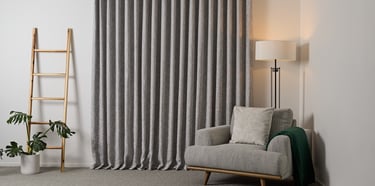 Product photography - a chair and ladder in a room with curtains
